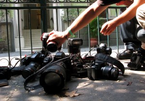 Photojournalists place their cameras on the floor during a demonstration condemning the alleged murder of fellow journalist Regina Martinez in Mexico City, Sunday April 29, 2012. The Mexican government's human rights commission said Sunday that it will investigate the apparent slaying of a correspondent for Proceso newsmagazine who often wrote about drug trafficking. Police found the body of Martinez on Saturday inside the bathroom of her home in the Veracruz state capital, Xalapa. (AP Photo/Marco Ugarte)