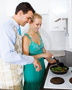 husband-teaching-wife-cooking-12836859